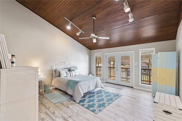 bedroom featuring ceiling fan, french doors, rail lighting, and access to outside