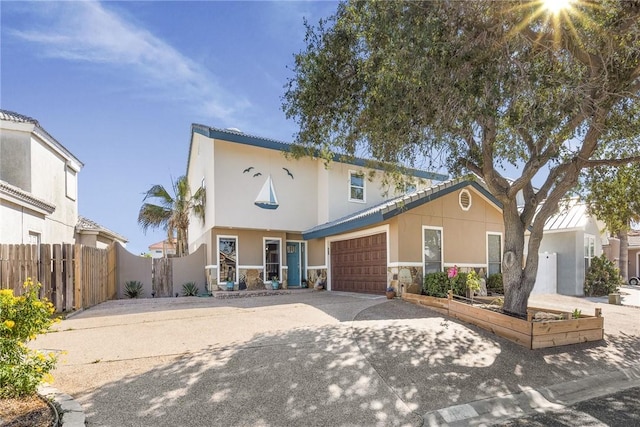13525 Bullion Ct, Corpus Christi, TX 78418 - view of front of home featuring concrete driveway, stucco siding, and an attached garage