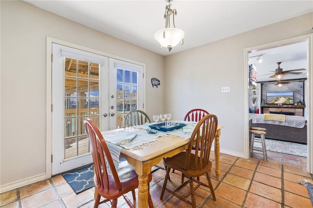 dining room with light tile patterned floors and french doors