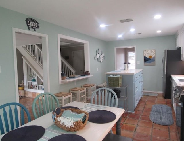 13525 Bullion Ct, Corpus Christi, TX 78418 - dining room featuring stairway, recessed lighting, and light tile patterned floors