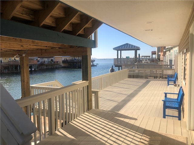 dock area with a water view and a gazebo