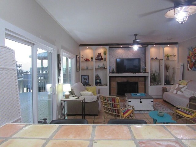 13525 Bullion Ct, Corpus Christi, TX 78418 - living area featuring a ceiling fan and a fireplace