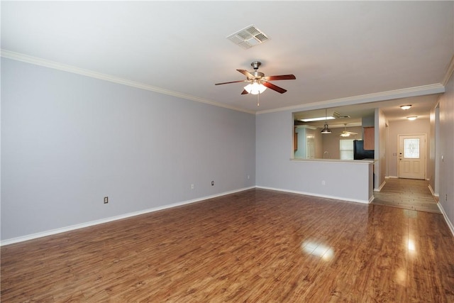 6513 Purplewing Dr, Corpus Christi, TX 78414 - unfurnished living room featuring crown molding, wood finished floors, baseboards, and a ceiling fan
