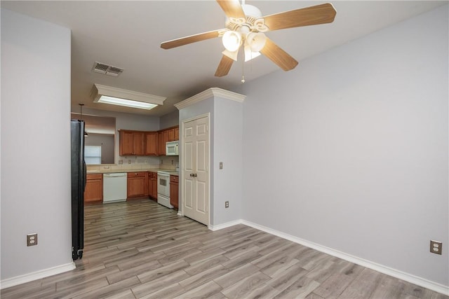 6513 Purplewing Dr, Corpus Christi, TX 78414 - kitchen featuring white appliances, light wood-type flooring, baseboards, light countertops, and ceiling fan