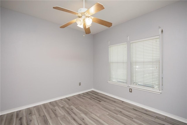 6513 Purplewing Dr, Corpus Christi, TX 78414 - unfurnished room with wood finished floors, baseboards, and ceiling fan