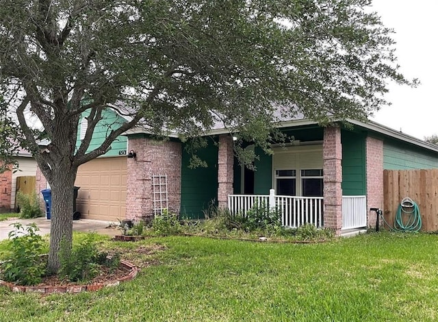 6513 Purplewing Dr, Corpus Christi, TX 78414 - view of front of house with brick siding, covered porch, an attached garage, and driveway