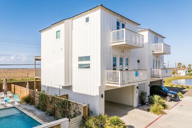 exterior space featuring a fenced in pool