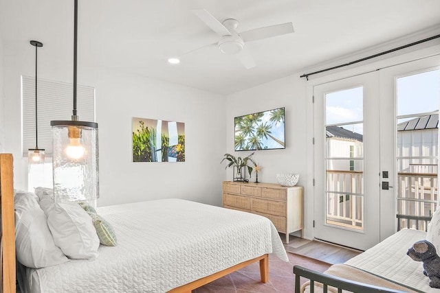 bedroom with access to outside and ceiling fan