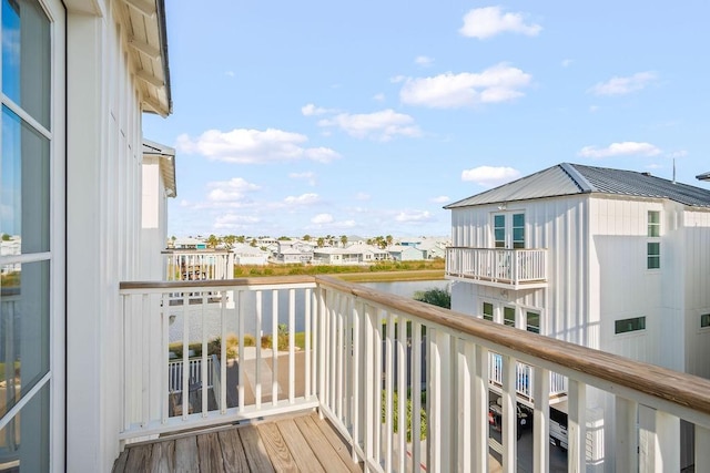 balcony featuring a water view