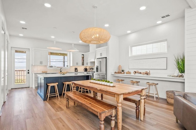 dining room featuring light hardwood / wood-style flooring