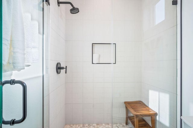 bathroom featuring an enclosed shower