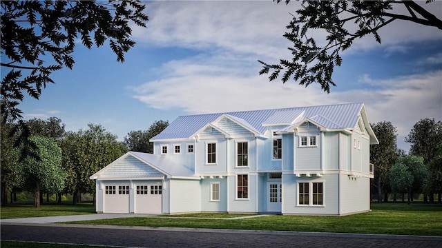 view of front of home featuring a garage and a front lawn