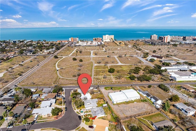 birds eye view of property featuring a water view