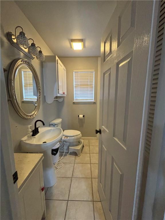 bathroom featuring tile patterned floors and toilet