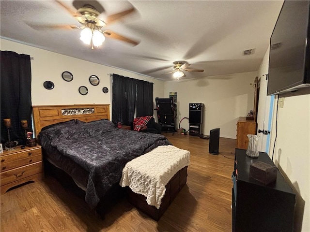 bedroom featuring hardwood / wood-style floors and ceiling fan