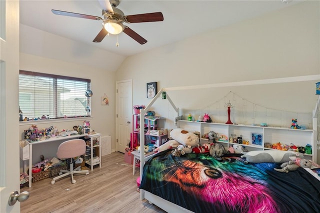 bedroom with lofted ceiling, ceiling fan, and wood finished floors