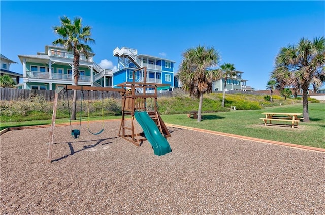 community jungle gym featuring a yard