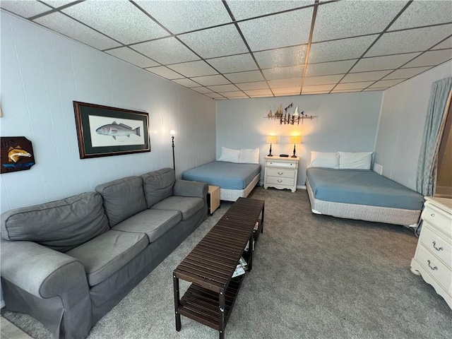 carpeted living room featuring a paneled ceiling