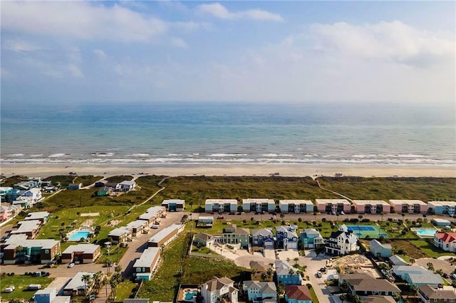 bird's eye view with a beach view and a water view