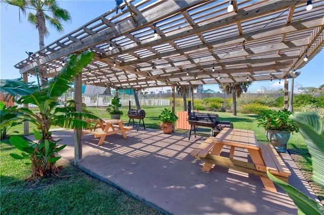 surrounding community featuring a yard, a patio area, fence, and a pergola