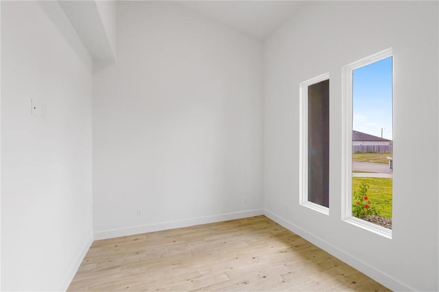 empty room with light hardwood / wood-style flooring