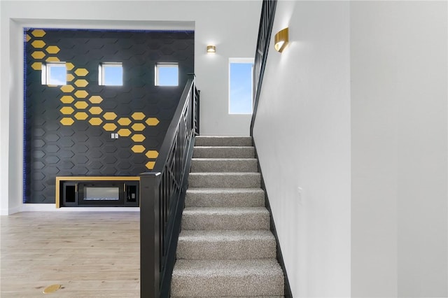 staircase with wood-type flooring