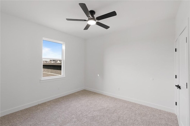 empty room with ceiling fan and carpet flooring