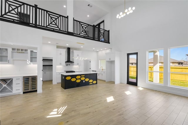 living room featuring a high ceiling and beverage cooler