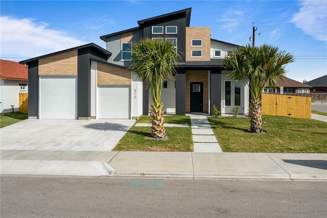 modern home with a front lawn and a garage