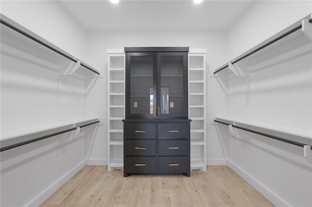 spacious closet featuring light wood-type flooring