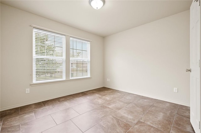 view of tiled spare room