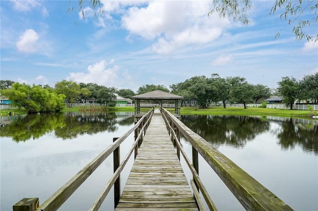 view of dock with a water view and a gazebo