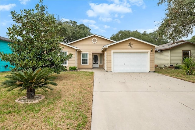 ranch-style house featuring a garage and a front yard