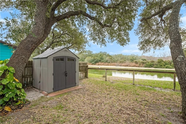 view of outbuilding with a water view