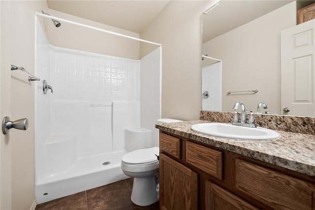 bathroom with walk in shower, vanity, toilet, and tile patterned flooring