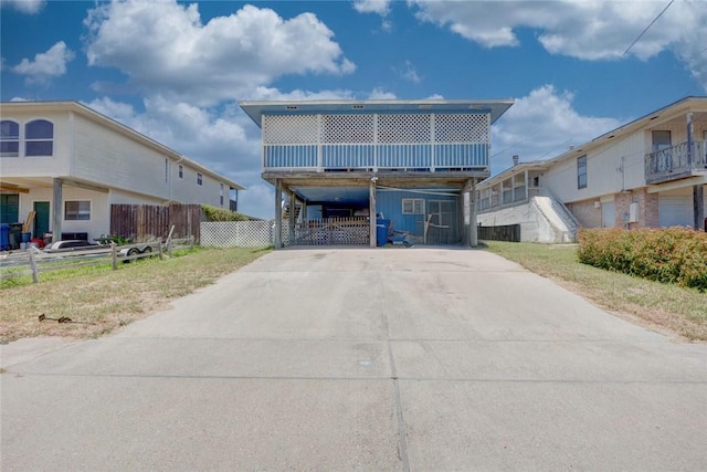3410 Laguna Shrs, Corpus Christi, TX 78418 - beach home featuring concrete driveway and a carport