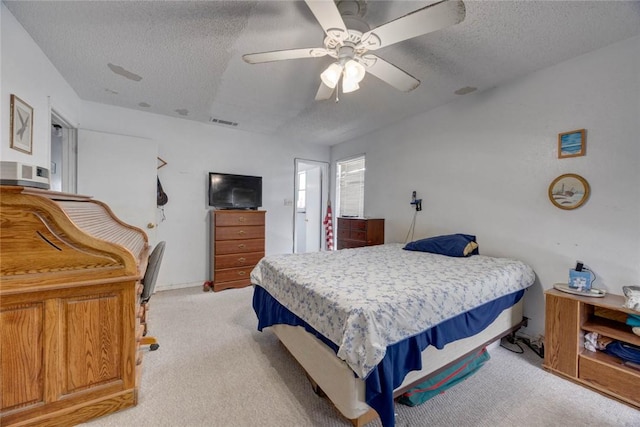 3410 Laguna Shrs, Corpus Christi, TX 78418 - bedroom with a textured ceiling, light colored carpet, and ceiling fan