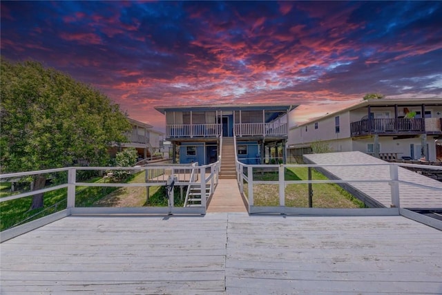 3410 Laguna Shrs, Corpus Christi, TX 78418 - view of front of house featuring a wooden deck and stairway