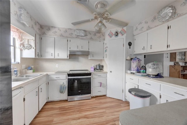 3410 Laguna Shrs, Corpus Christi, TX 78418 - kitchen featuring appliances with stainless steel finishes, a ceiling fan, under cabinet range hood, white cabinets, and light wood-type flooring