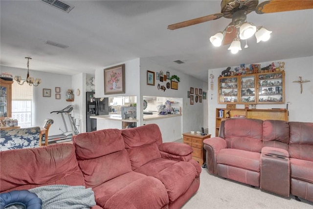 3410 Laguna Shrs, Corpus Christi, TX 78418 - living area with light colored carpet, a chandelier, and ceiling fan
