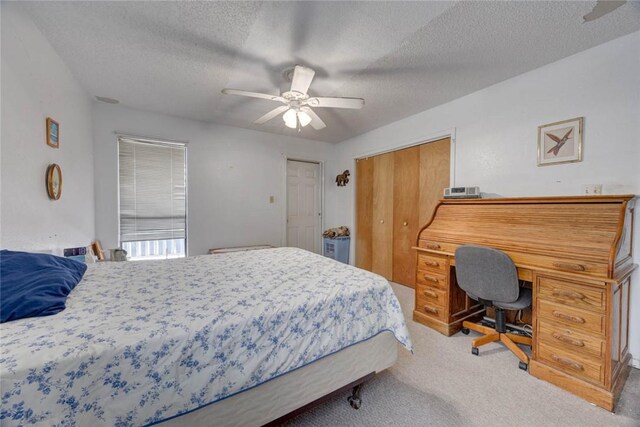 3410 Laguna Shrs, Corpus Christi, TX 78418 - bedroom with carpet flooring, a textured ceiling, and ceiling fan
