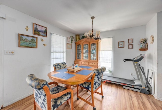 3410 Laguna Shrs, Corpus Christi, TX 78418 - dining space featuring light wood-style flooring and a chandelier