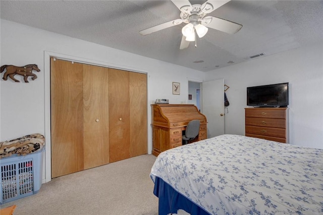 3410 Laguna Shrs, Corpus Christi, TX 78418 - carpeted bedroom with a closet, a ceiling fan, and a textured ceiling