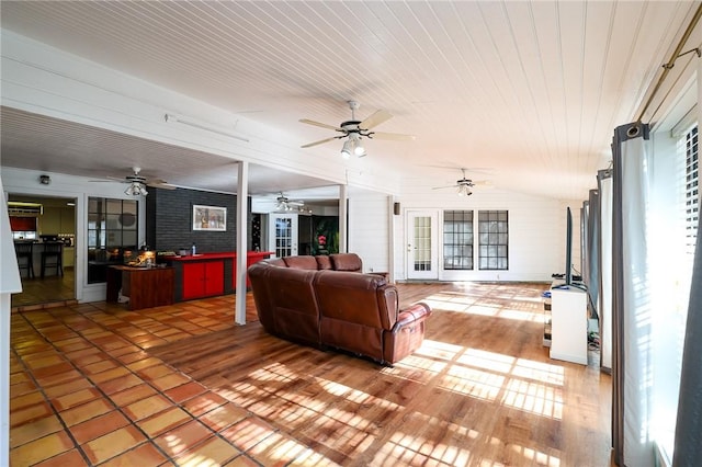 living room featuring lofted ceiling