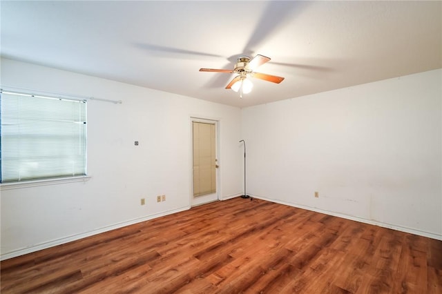 empty room featuring hardwood / wood-style flooring and ceiling fan