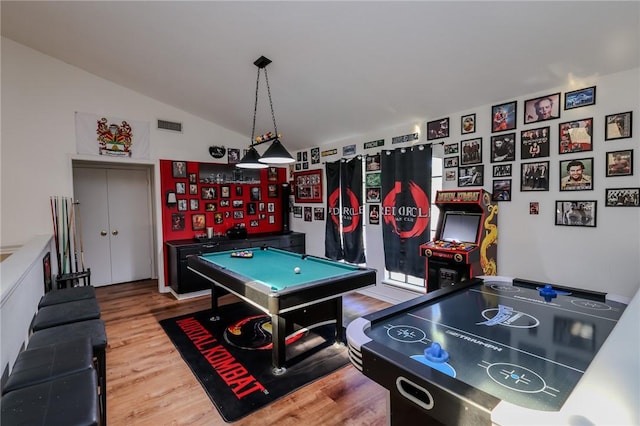 rec room featuring hardwood / wood-style floors, lofted ceiling, and pool table