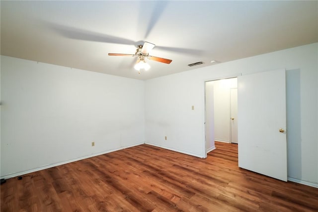 unfurnished room featuring ceiling fan and hardwood / wood-style floors