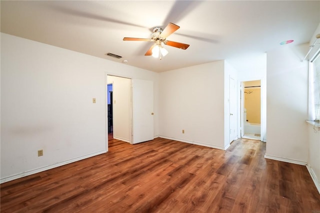 unfurnished room featuring dark hardwood / wood-style floors and ceiling fan