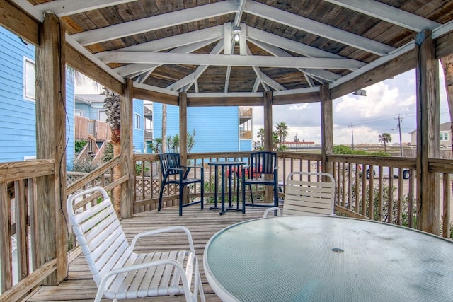 wooden terrace featuring a gazebo