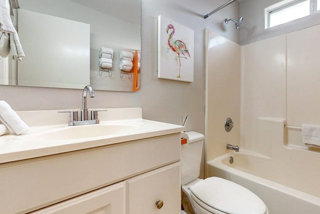 full bathroom featuring vanity, tub / shower combination, and toilet